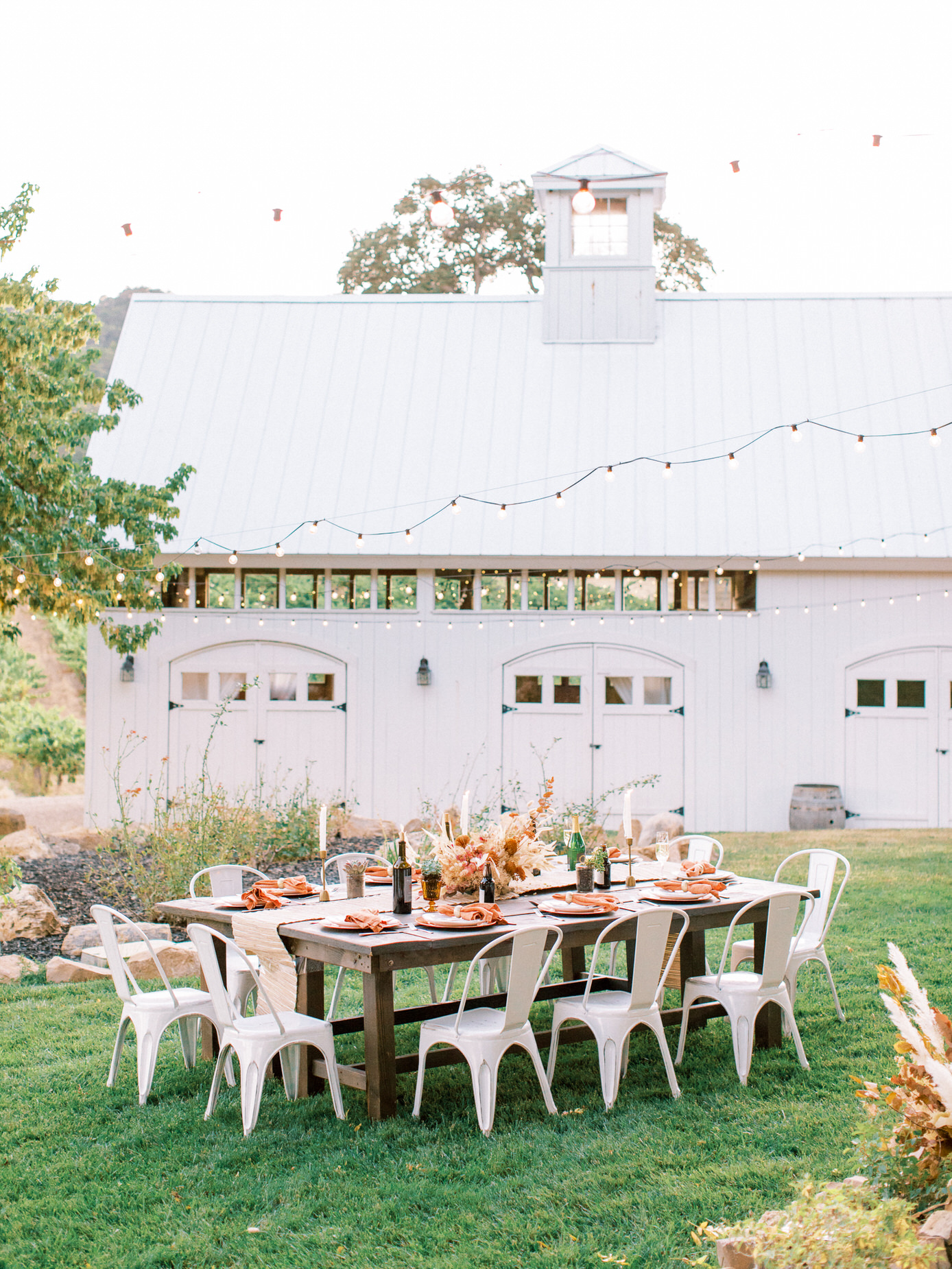 Elegant white barn with outdoor wedding table Central Coast Wedding Venues